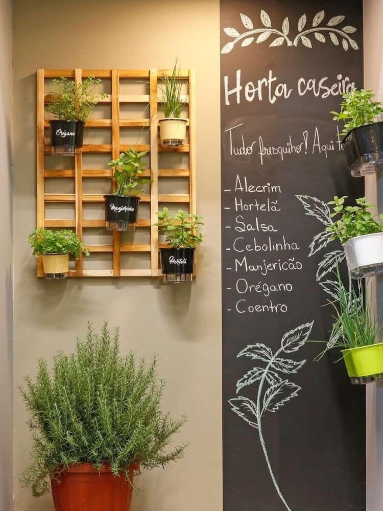 indoor herb wall with chalkboard and wooden pallet