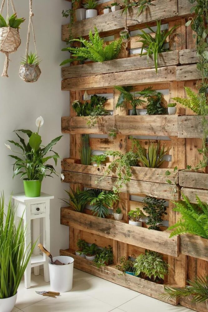 indoor pallet wall garden with white pots and macrame