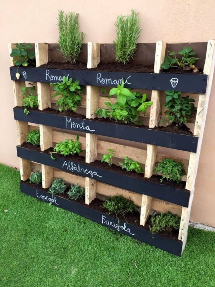 pallet garden with black painted name labels